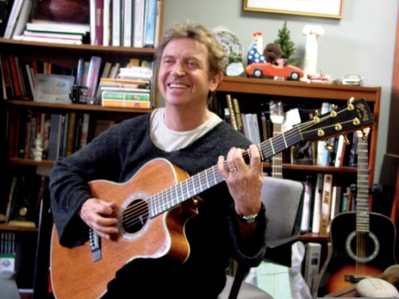Andy Summers plays his Signature model Martin in the office of Chris Martin 