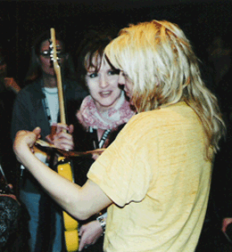 Courtney Love signs Daisy Rock Prototype