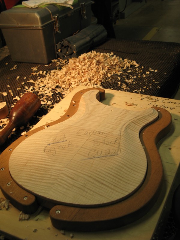 PRS electric guitar body, just after being roughly carved, before hand work begins
