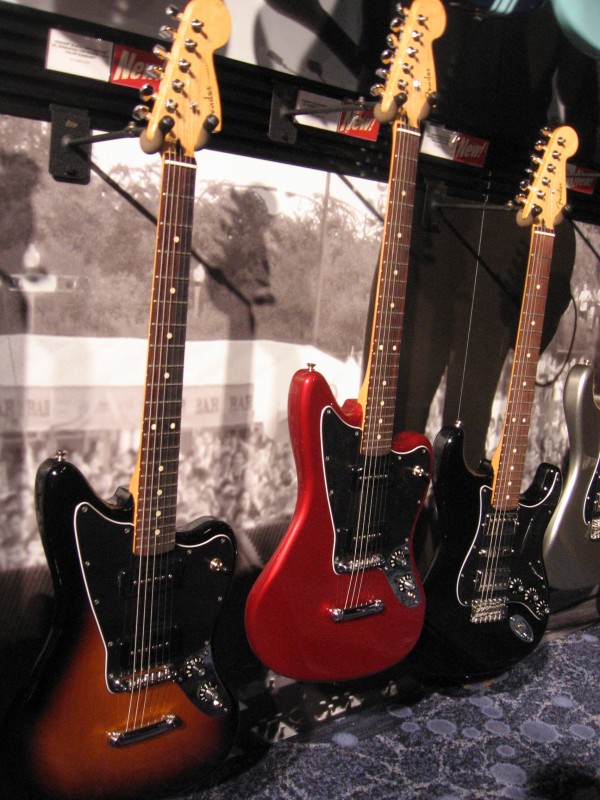 Two Fender Blacktop Jaguar 90 and a Strat HSH on the right