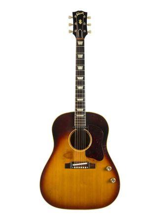 John Lennon's original 1962 J-160E Gibson Acoustic guitar is shown in this handout publicity photo released to Reuters June 2, 2015.  REUTERS/Julien's Auctions/Handout via Reuters